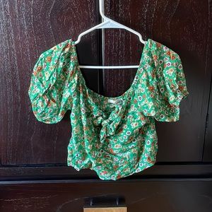 Francesca’s cropped green floral shirt